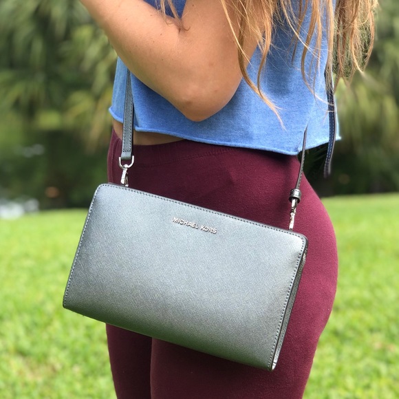 Michael Kors Handbags - Michael Kors Silver Crossbody Or Clutch